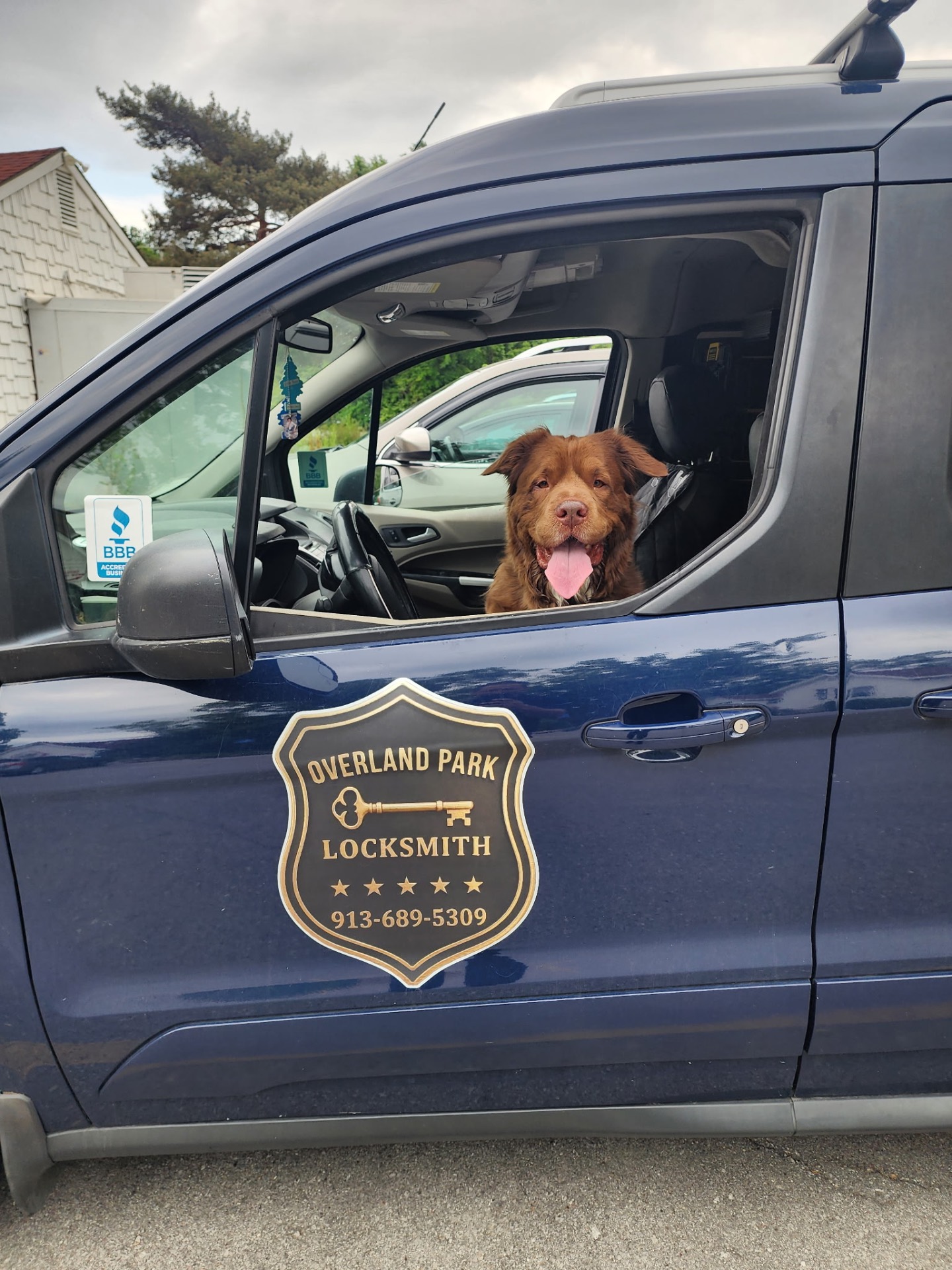 Overland Park Locksmith service van with friendly shop dog riding along